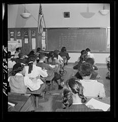 Washington, D.C. Class listening to a radio broadcast about South America, sponsored by a local station (Image Public Domain, U.S. Farm Security Administration/Office of War Information Black & White Photographs)