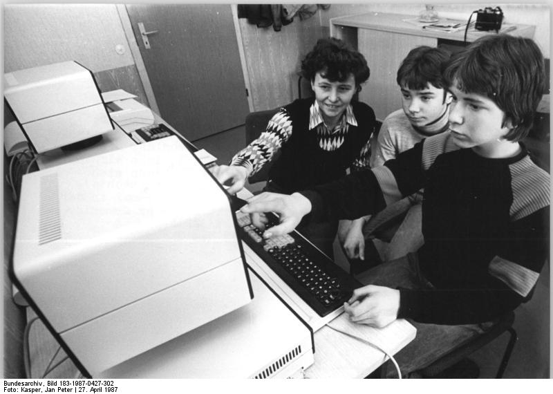 Students interact with computer in classroom, ca.1987 