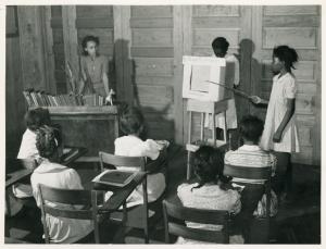 4th and 5th in Flint River school, Ga. demonstrate a health moving picture, which they made. May 1939. (NYPL Digital Collection)